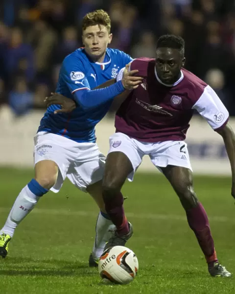 Rangers Macleod Fends Off Arbroath's Banjo in Scottish League One Clash at Gayfield Park