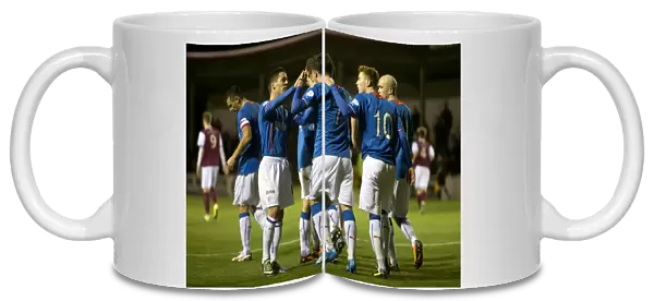 Rangers Nicky Clark Scores and Celebrates with Team Mates in Scottish League One: A Goal to Remember (vs Arbroath at Gayfield Park)
