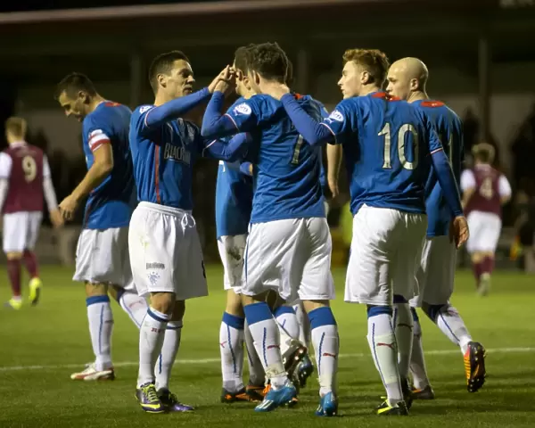 Rangers Nicky Clark Scores and Celebrates with Team Mates in Scottish League One: A Goal to Remember (vs Arbroath at Gayfield Park)