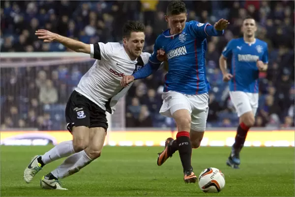 Rangers vs Ayr United: Fraser Aird vs Adam Hunter - Intense Battle at Ibrox Stadium, Scottish League One
