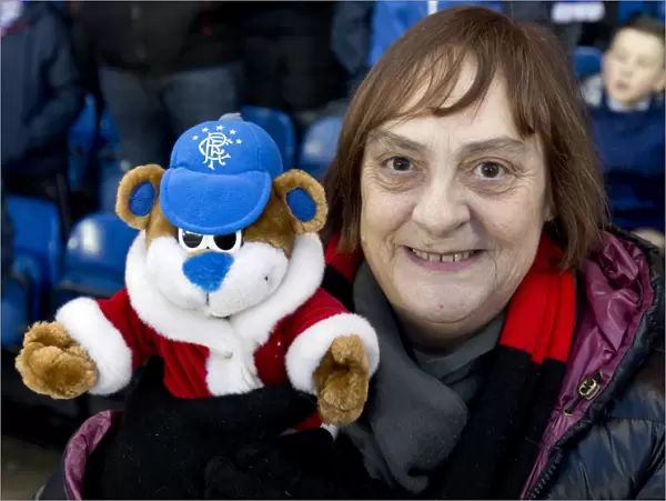 A Rangers Fan's Triumph: Holding the Scottish Cup with Beloved Teddy Bear at Ibrox Stadium (2003)