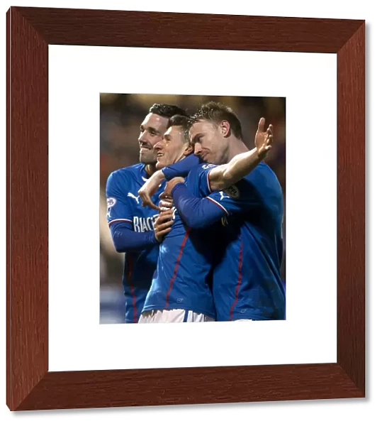 Rangers Aird, Clark, and Smith: Triumphant Goal Celebration in Scottish League One vs. Dunfermline Athletic