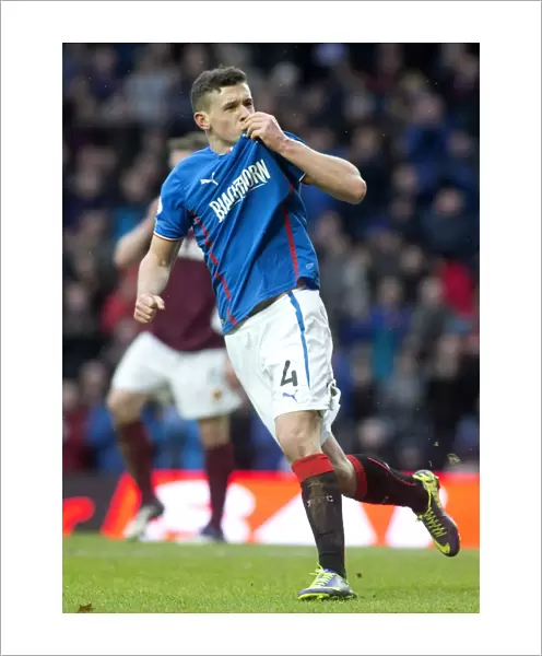 Rangers Fraser Aird: Emotional Goal Celebration with Ibrox Club Badge (Scottish League One)