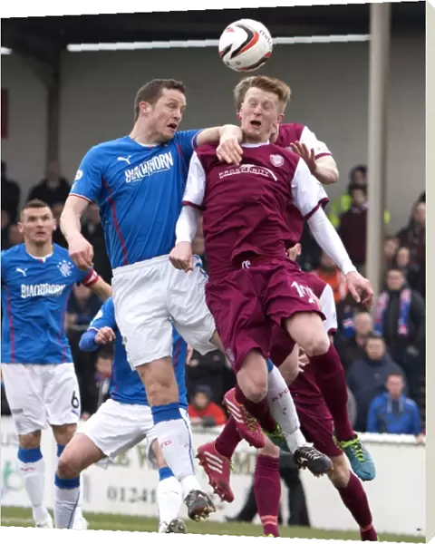 Clash at Gayfield Park: Rangers Jon Daly and Alan Cook in Epic Heading Duel (Scottish Cup, 2003)