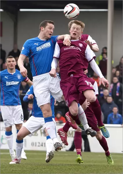 Clash at Gayfield Park: Rangers Jon Daly and Alan Cook in Epic Heading Duel (Scottish Cup, 2003)