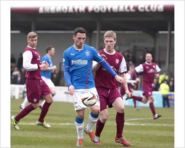 Rangers Nicky Clark Fends Off Arbroath's Colin Hamilton in Scottish League One Clash at Gayfield Park