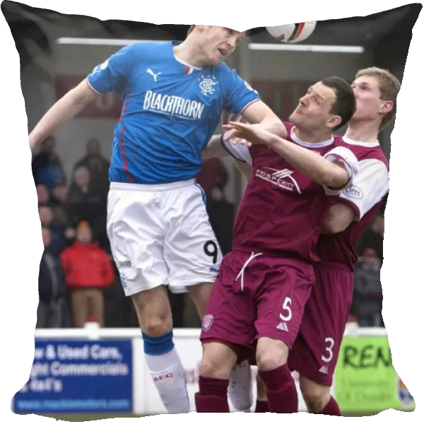 Rangers Jon Daly Soars Over Defenders in Scottish League One Clash vs Arbroath