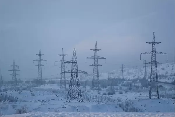 Power transmission lines are seen on a frosty day outside the town of Monchegorsk in