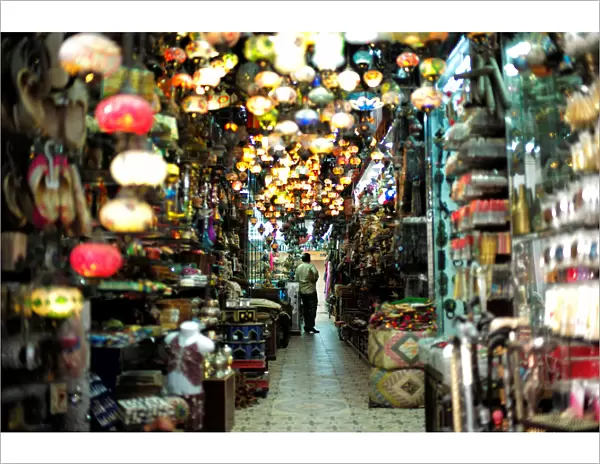 A visitor looks at traditional light-shop in local souq at Bab al Bahrain in Manama