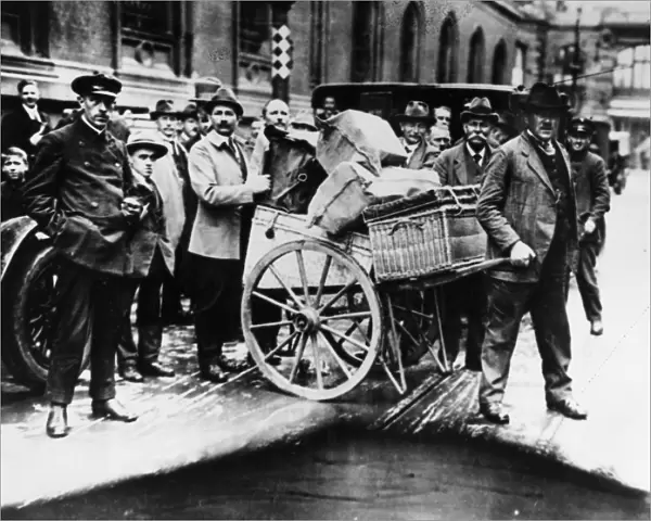 GERMANY: INFLATION, 1923. A large firms weekly payroll is transported from the