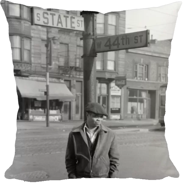 CHICAGO, 1941. Man standing at the corner of State and 44th Streets in Chicago, Illinois