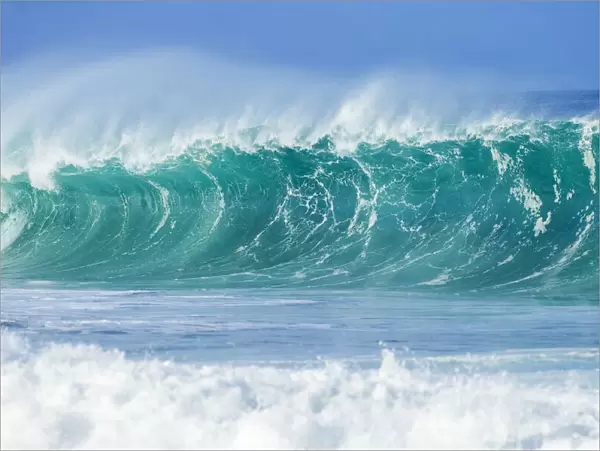 Ocean wave cresting before reaching the shore on Oahu, Hawaii, USA
