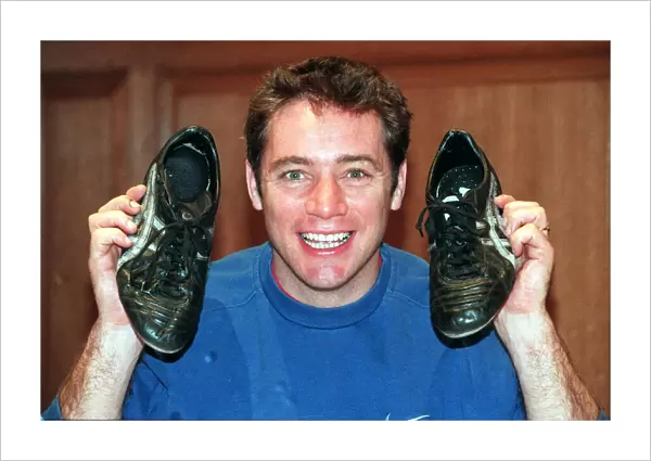 Ally McCoist actions football boots for Cash For Kids. Charity November