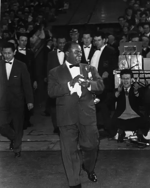 American jazz musician Louis Armstrong emerges from the players tunnel at Ibrox Stadium