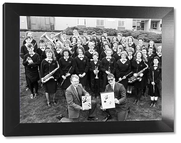 In harmony... Rastrick High School Concert Band, seen with head of music Mr Peter Lynch