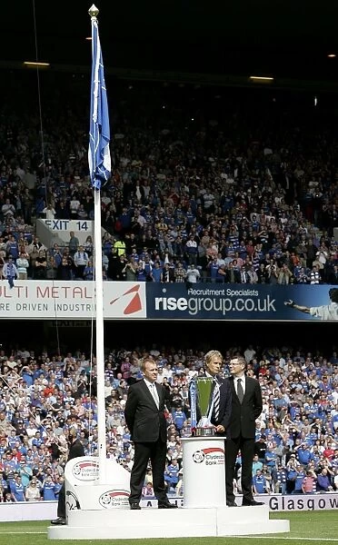 Alistair Johnston's Triumph: Rangers Chairman Lifts the SPL Trophy at Ibrox Stadium after Rangers 2-1 Victory over Kilmarnock