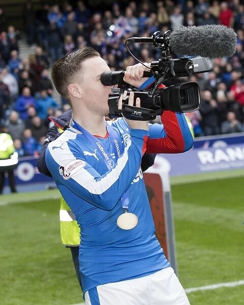 Barrie McKay's Triumphant Moment with the Ladbrokes Championship Trophy at Ibrox Stadium