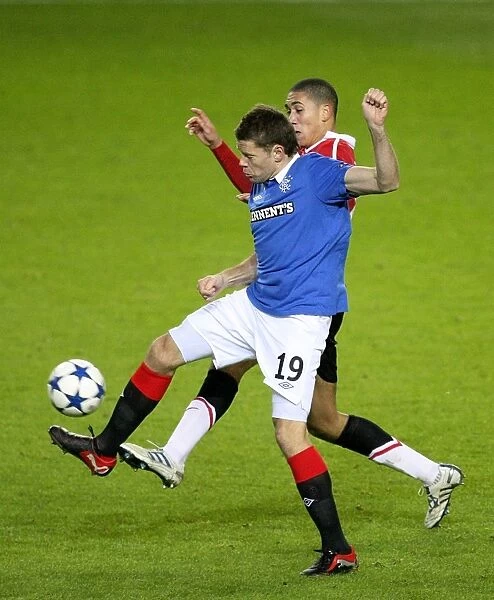 Battle for the Ball: Beattie vs. Smalling - Rangers vs. Manchester United in UEFA Champions League Group C (19-year-old Beattie vs. Smalling at Ibrox)