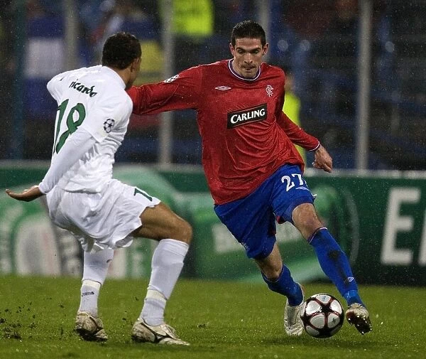 Battle for the Ball: Kyle Lafferty vs Pablo Brandan in Rangers vs Unirea Urziceni, UEFA Champions League Group G (1-1)