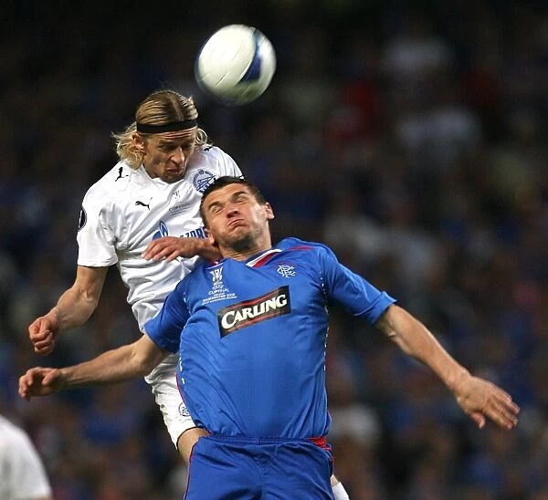 Battle for the Ball: Tymoschuk vs. McCulloch in the Intense UEFA Cup Final Clash between Zenit Saint Petersburg and Rangers (2008) at City of Manchester Stadium