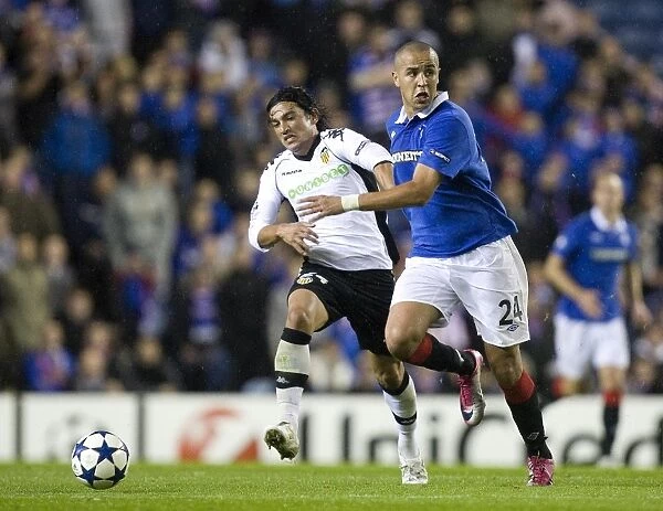 Battle of Ibrox: Rangers vs Valencia - Majid Bougerra vs Tino Costa's Intense Clash in UEFA Champions League Group C - A 1-1 Stalemate in Blue and White