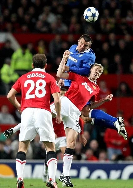 A Battle at Old Trafford: Lee McCulloch vs Darren Fletcher - Champions League Showdown: Rangers McCulloch Outmuscles United's Fletcher in Epic Heading Duel (Manchester United 0-0 Rangers)