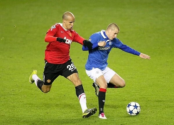 Battle for Supremacy: Obertan vs. Weiss at Ibrox Stadium - Manchester United Tops Rangers in UEFA Champions League Group C (Rangers 0-1)