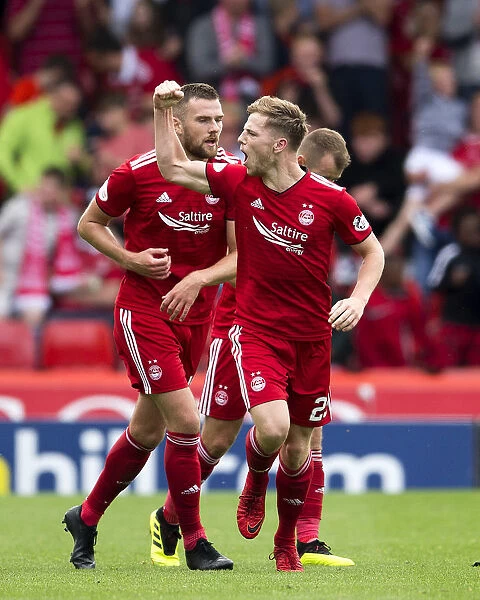 Bruce Anderson's Euphoric Goal Celebration: Aberdeen's Thrilling Victory in the Ladbrokes Premiership at Pittodrie Stadium