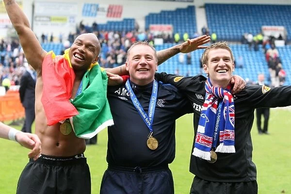 Celebrating Champions: Rangers Diouf, McCoist, and Davis at Rugby Park (Rangers 2010-11 SPL Title Win)