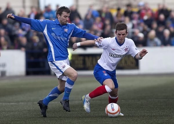 David Templeton and David Gray in Action: A Scoreless Battle in Montrose vs Rangers Third Division Clash at Links Park