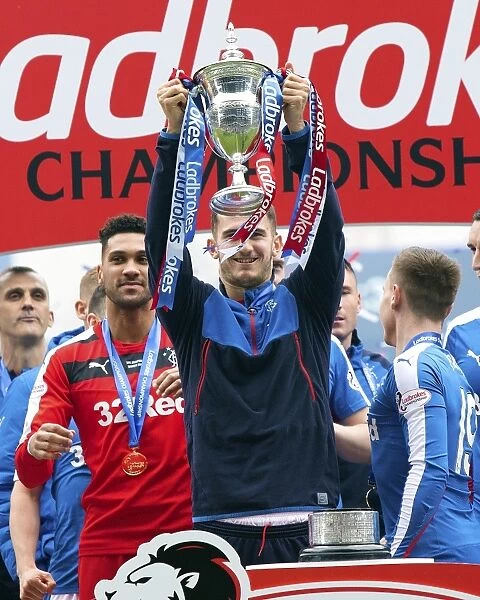Dominic Ball Celebrates with the Ladbrokes Championship Trophy at Ibrox Stadium