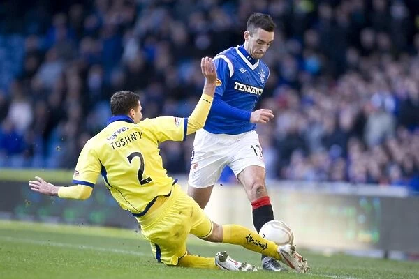 Dramatic Encounter at Ibrox: Lee Wallace vs. Lewis Toshney - Kilmarnock Takes the Lead (1-0)