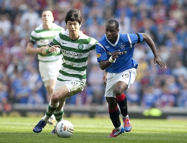 Dramatic Moment: Sone Aluko Scores the Winning Goal Past Ki Sung Yueng at Ibrox Stadium (Rangers 3-2 Celtic)
