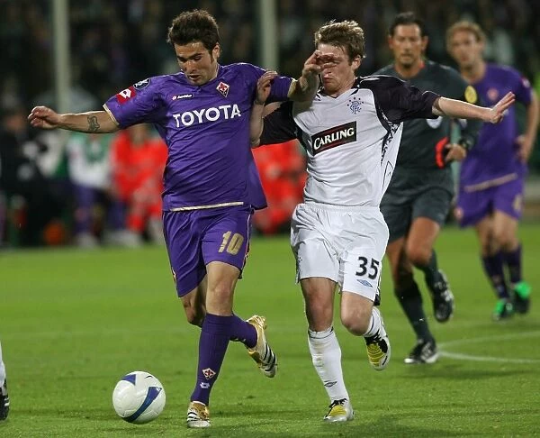 Dramatic Showdown: Steven Davis vs. Adrian Mutu in the UEFA Cup Semi-Final: Fiorentina vs. Rangers (0-0, 2-4 on Penalties)