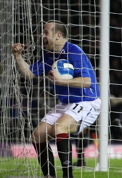 European Nights at Ibrox: Rangers Double Delight - Charlie Adam and Steven Davis Score Against Werder Bremen in the UEFA Cup (Round of 16, First Leg)