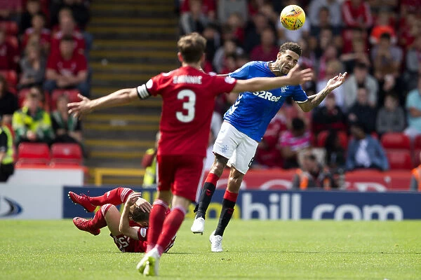 Goldson Fouls Anderson: Intense Moment in Rangers vs Aberdeen Ladbrokes Premiership Clash at Pittodrie Stadium