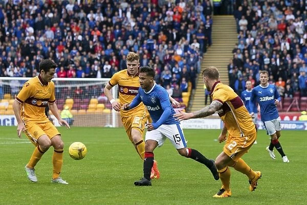 Harry Forrester Fights for Possession: Motherwell vs Rangers - Betfred Cup Showdown at Fir Park
