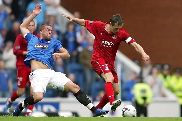 A Historic Clash: Rangers vs Aberdeen in the Premier Division at Ibrox Stadium - Sebo's Leadership vs Aberdeen's Resilience