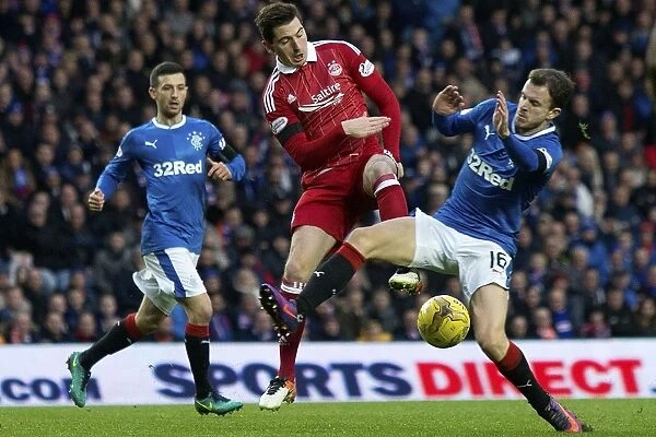 Intense Battle at Ibrox: Rangers Andy Halliday Tackles Aberdeen's Kenny McLean