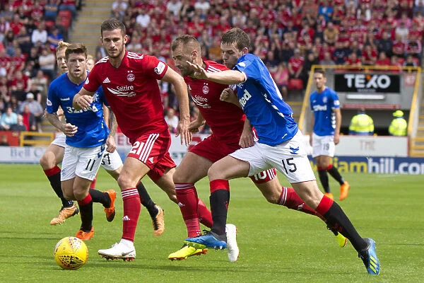 Intense Battle: Jon Flanagan Fights for Ball in Rangers vs Aberdeen Ladbrokes Premiership Clash at Pittodrie Stadium