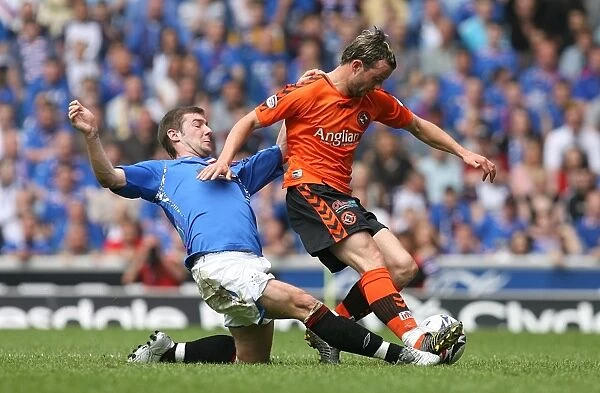 Intense Clash: Kevin Thomson Fouls Noel Hunt (Rangers 3-1 Dundee United)