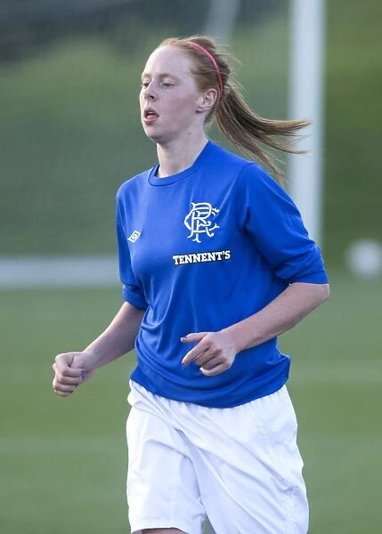 Intense Moment: Kathryn Hill Faces Off Against Hibernian Ladies in Scottish Women's Premier League Soccer Match (Rangers vs Hibernian)