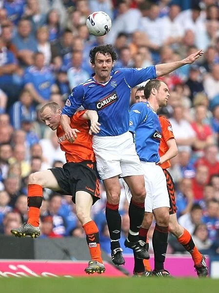 Intense Rivalry: Flood vs. Dailly - Rangers vs. Dundee United's Battle for the Ball (3-1) at Ibrox