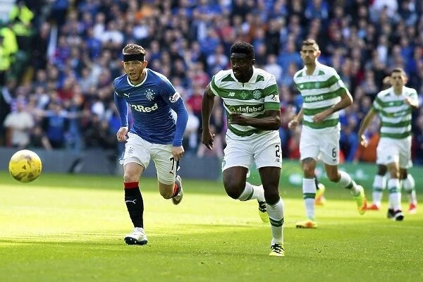 Intense Rivalry: Joe Garner Chases the Ball in the Rangers vs Celtic Clash at Celtic Park