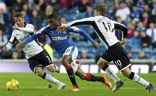 Intense Rivalry: Nathan Oduwa's Battle for the Ball in Rangers vs St. Johnstone Scottish League Cup Clash at Ibrox Stadium