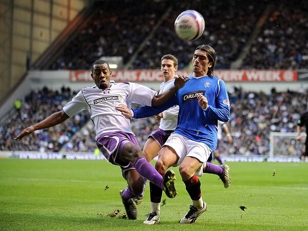 Intense Rivalry: Pedro Mendes vs Simon Ford - Battle for the Ball in Rangers vs Kilmarnock's Clydesdale Bank Premier League Clash at Ibrox (3-1)