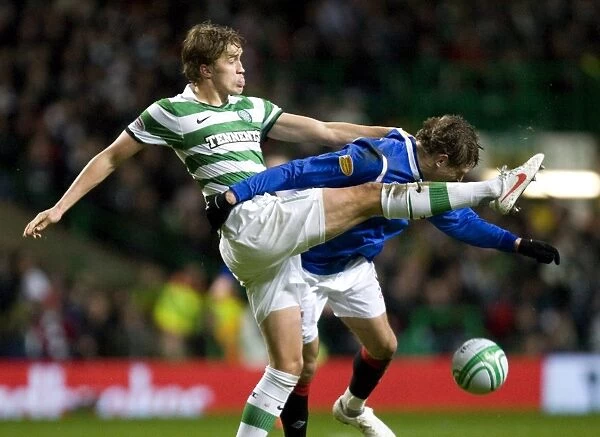 Jelavic vs Rogne: Intense Moment in Celtic vs Rangers Football Match (1-0)
