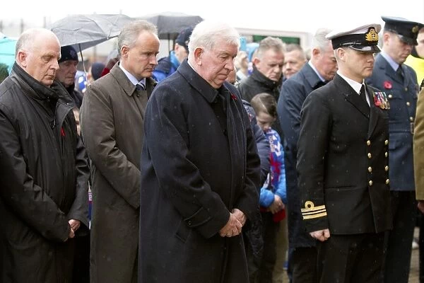 John Greig Honors Past Glories: A Moment of Silence at Ibrox Stadium on Remembrance Day
