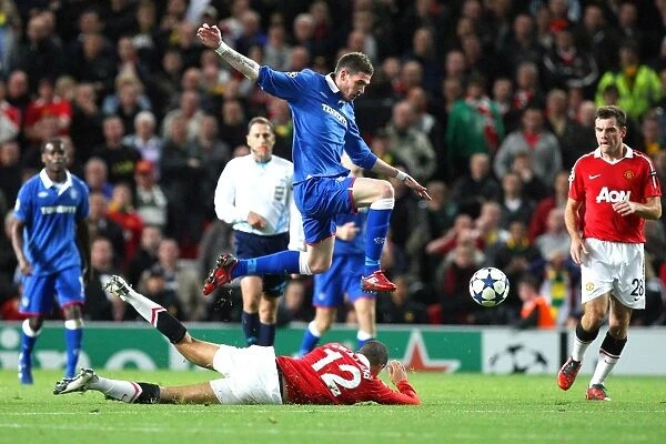 Lafferty Soars Over Smalling: Thrilling Moment from Rangers vs. Manchester United in UEFA Champions League