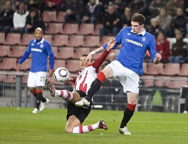 Lafferty vs Bouma: A Battle at Philips Stadion - 0-0 Stalemate in Rangers vs PSV Eindhoven UEFA Europa League Round of 16 First Leg